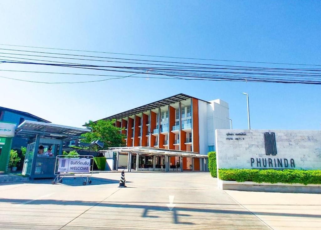 a building on a city street withphilippina written on it at Phurinda Residence in Sara Buri