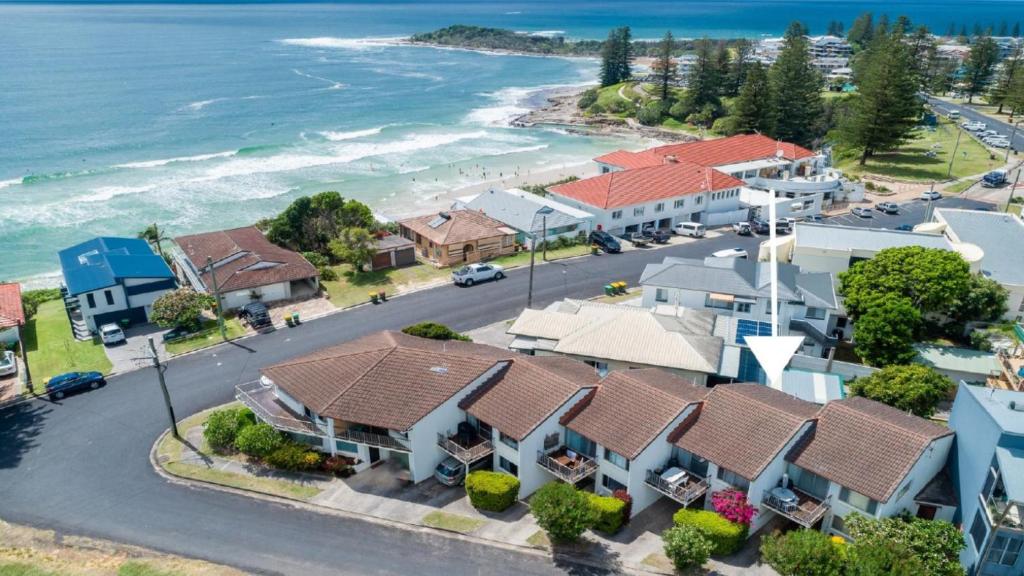 an aerial view of a coastal town with houses and the ocean at Lighthouse unit 2 in Yamba