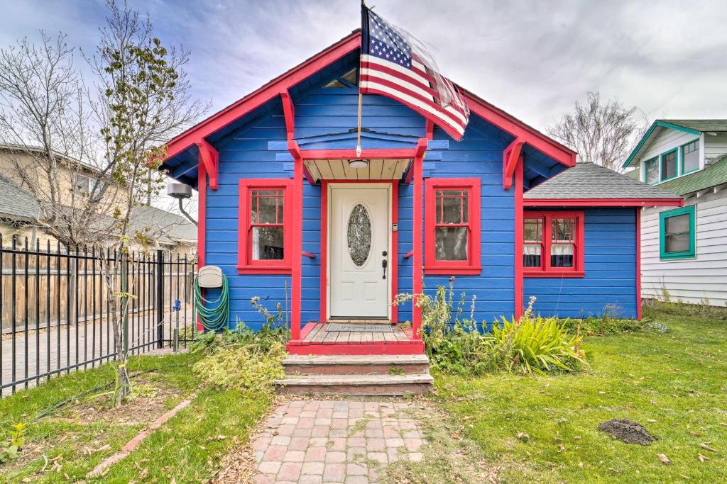 a blue and red house with an american flag at Sunny Sierra Valley Cottage Hike and Explore! 