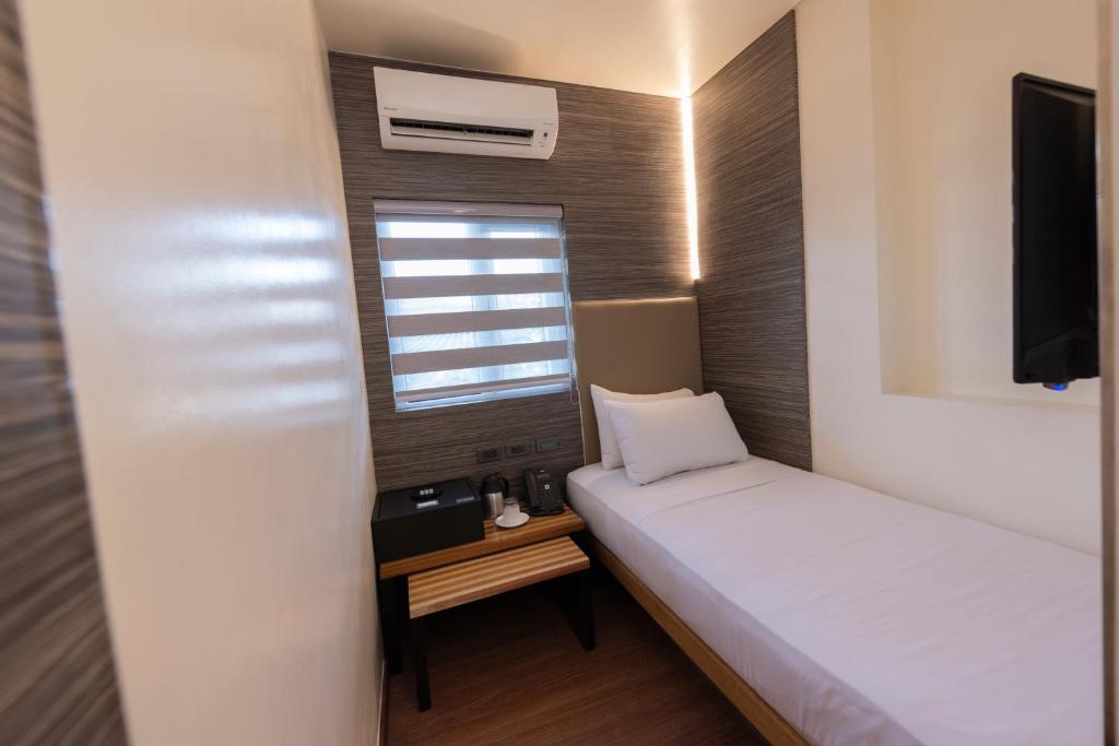 Kabayan Hotel Pasayにあるベッド
