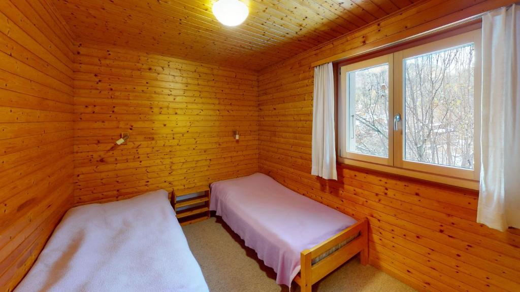 Postel nebo postele na pokoji v ubytování Ferienhaus Rehbock RB0