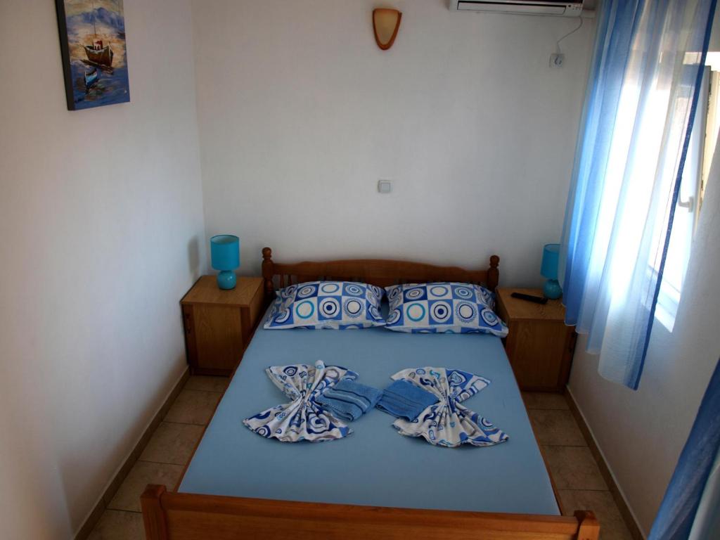 Postel nebo postele na pokoji v ubytování Friendly House