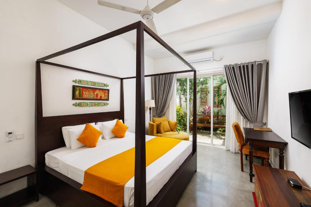 Postel nebo postele na pokoji v ubytování Angam Villas Colombo