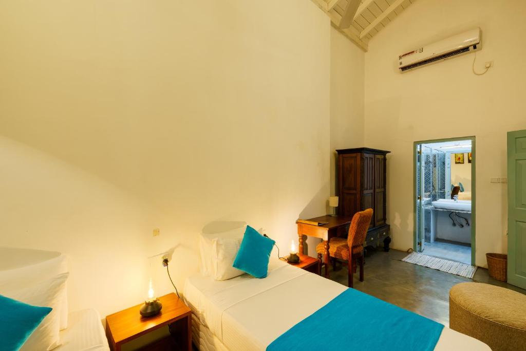 Postel nebo postele na pokoji v ubytování Angam Villas Colombo