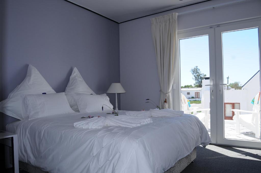 Postel nebo postele na pokoji v ubytování Quay West