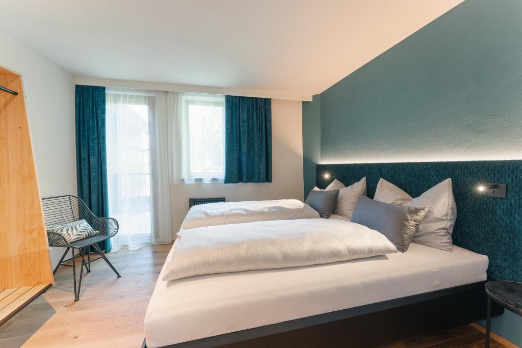 Postel nebo postele na pokoji v ubytování Ferienhaus Holzer