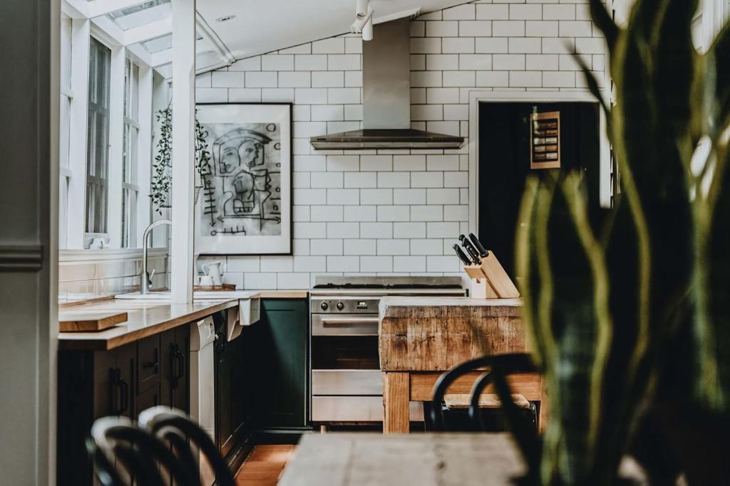 a kitchen with a sink and a stove at The Station House Daylesford in Daylesford