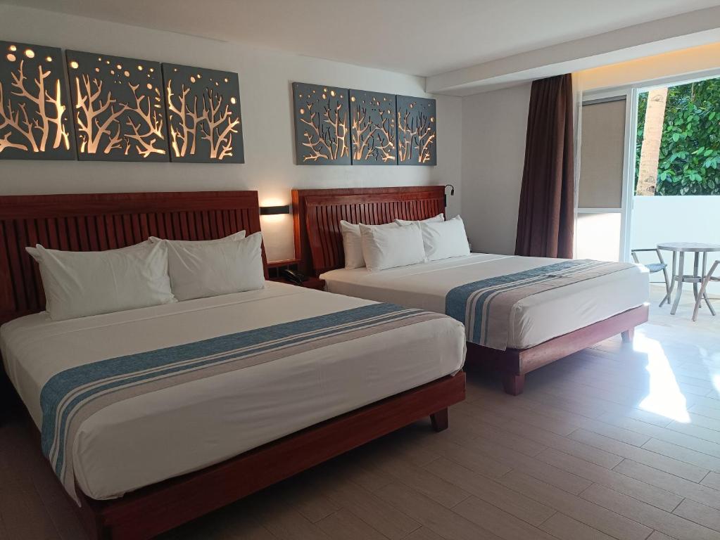 Postel nebo postele na pokoji v ubytování Aira Boracay Hotel