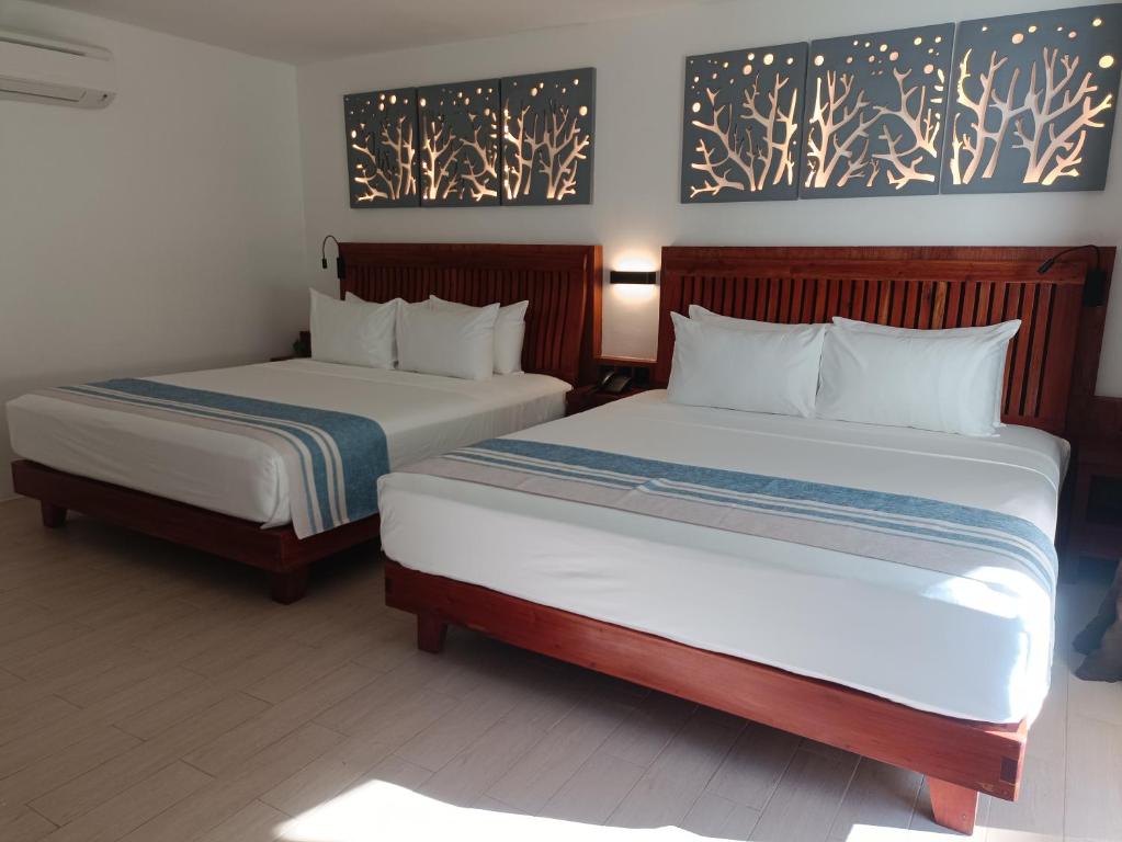 Postel nebo postele na pokoji v ubytování Aira Boracay Hotel