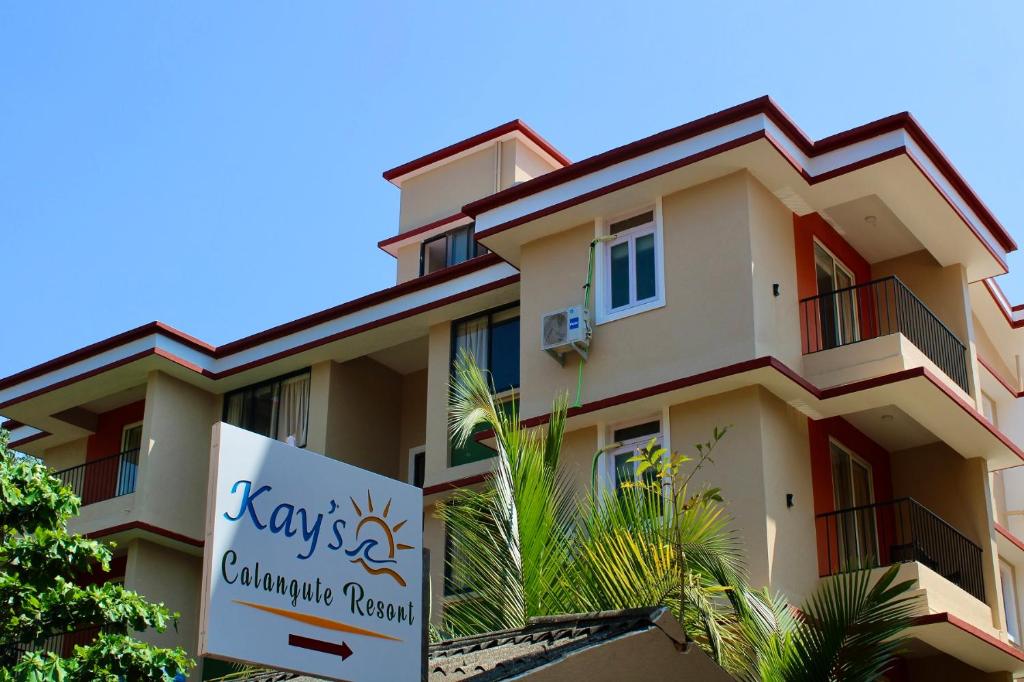 a building with a sign in front of it at Kay's Calangute Resort Service Apartments in Calangute