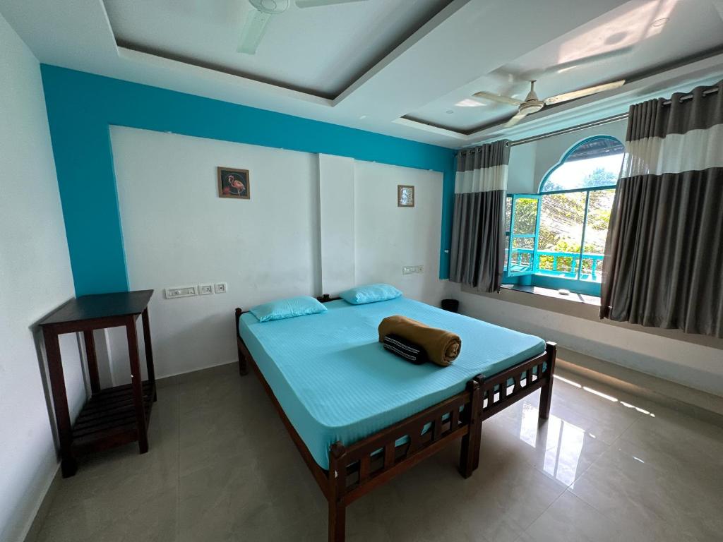 Postel nebo postele na pokoji v ubytování Soul Hostels, Varkala - Black Beach