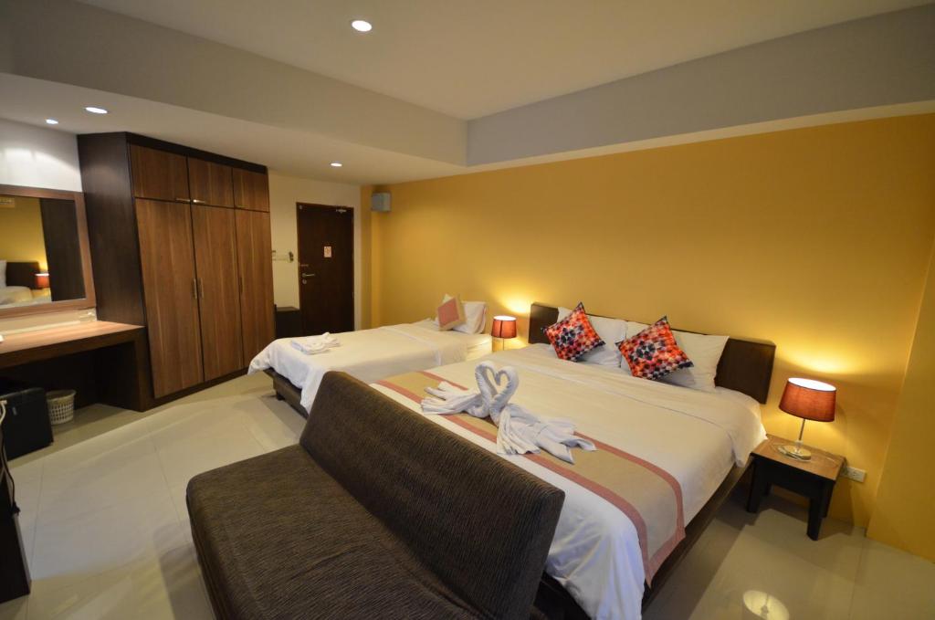 Postel nebo postele na pokoji v ubytování Cool Residence Hotel