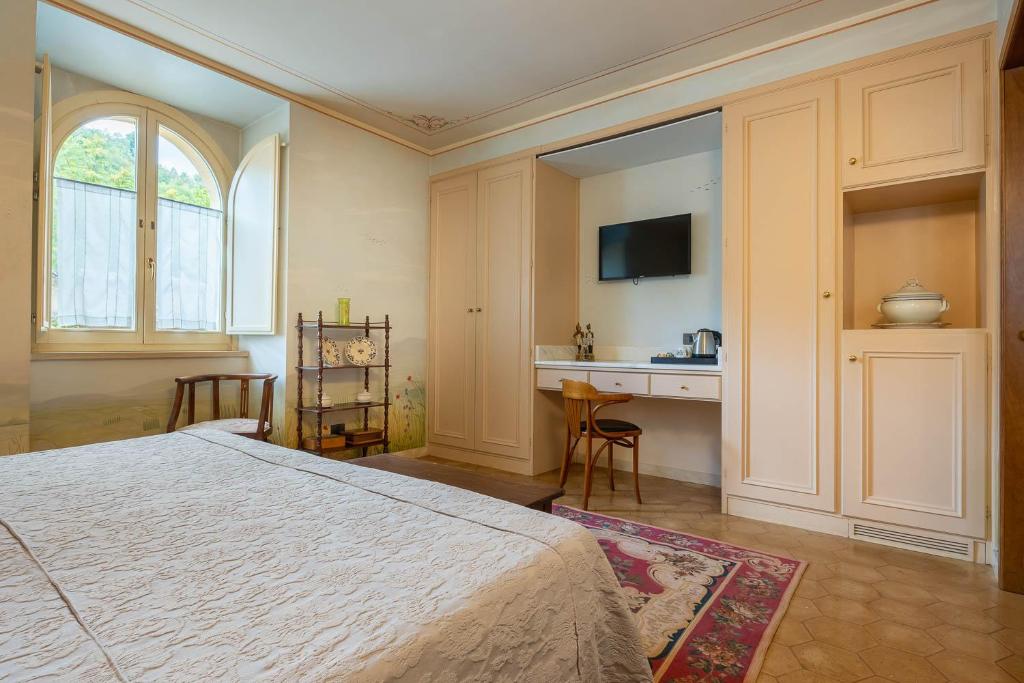 Postel nebo postele na pokoji v ubytování Hotel San Luca