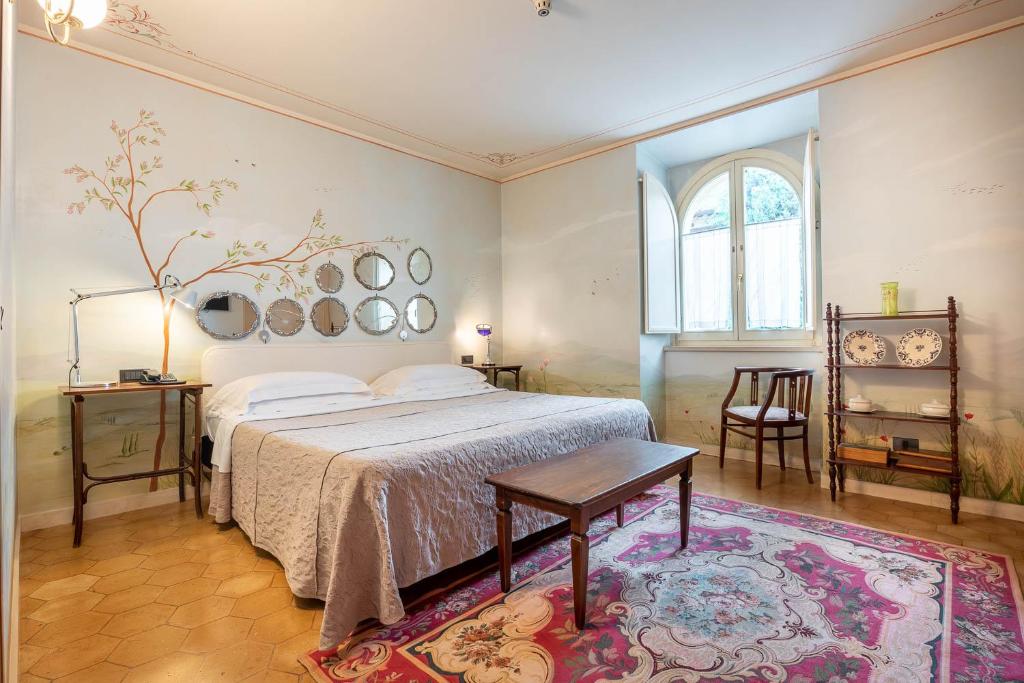 Postel nebo postele na pokoji v ubytování Hotel San Luca