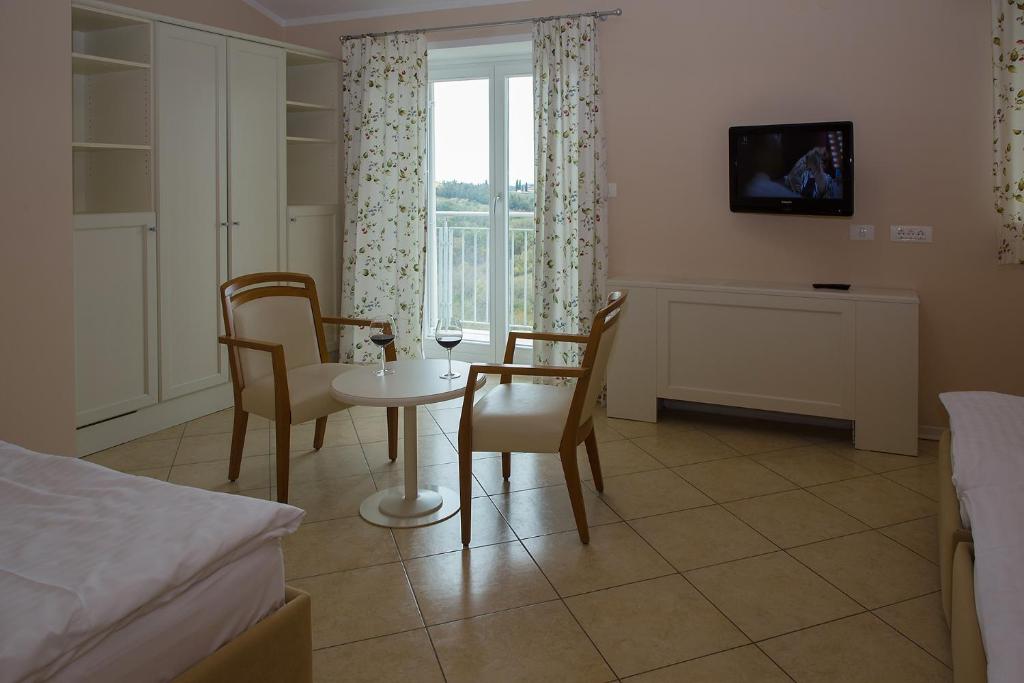 Postel nebo postele na pokoji v ubytování Hotel Kozana