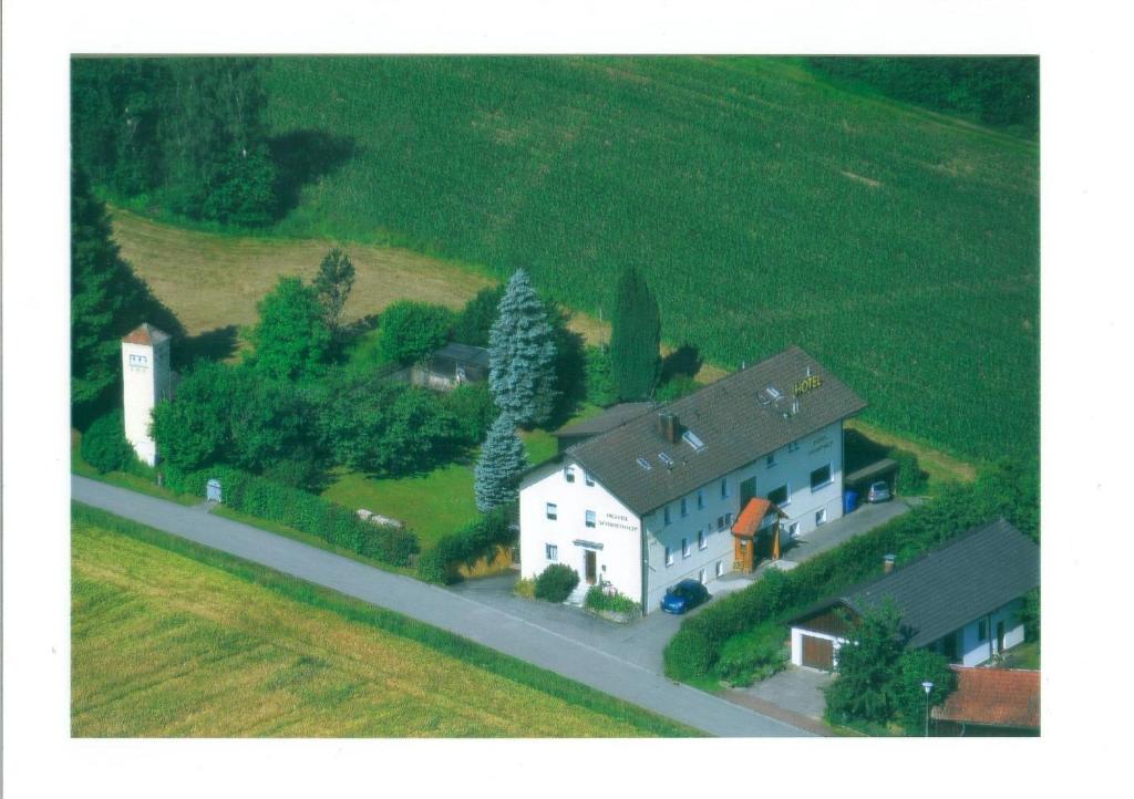 a model of a house and a church on a street at Hotel Sonnenhof in Cham