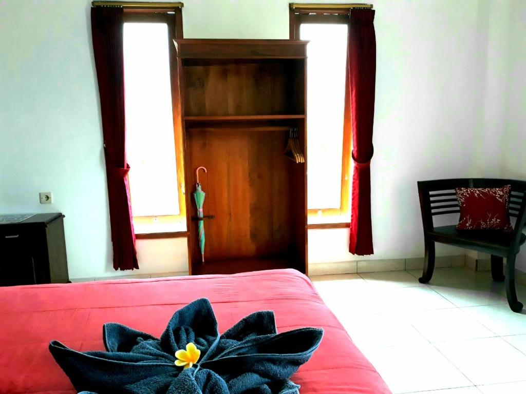 Postel nebo postele na pokoji v ubytování One Homestay and Warung