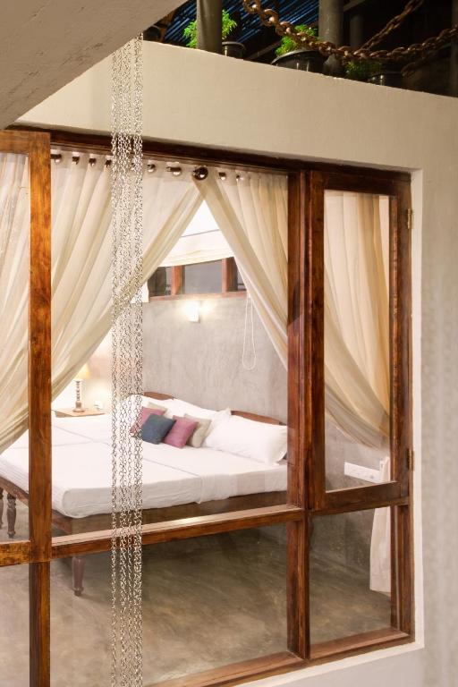 Postel nebo postele na pokoji v ubytování Niyati - Boutique Stay