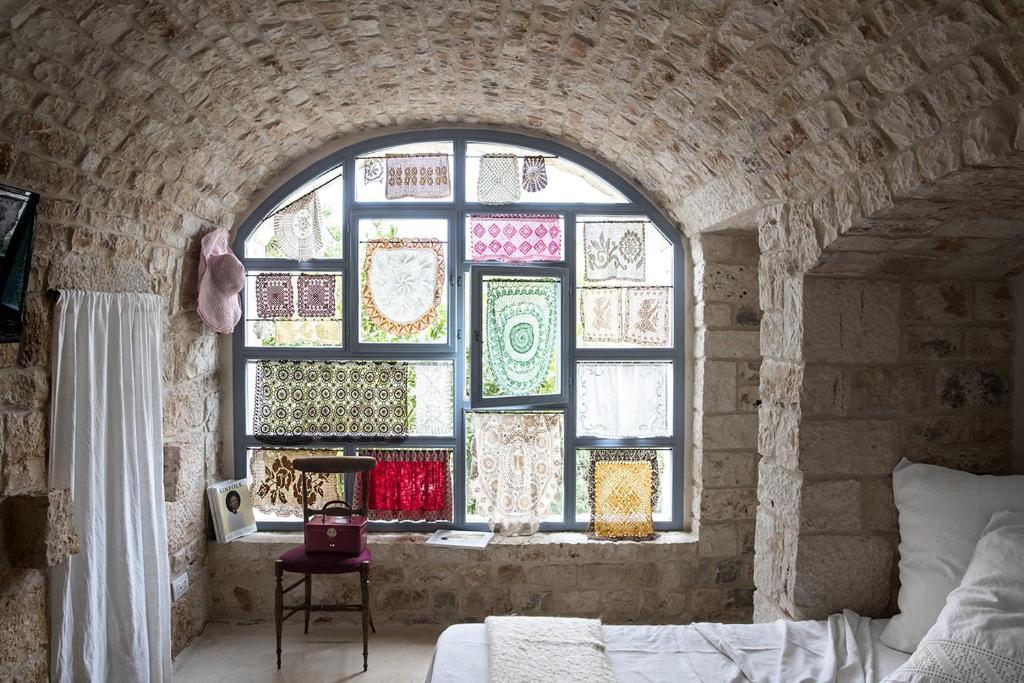 Posteľ alebo postele v izbe v ubytovaní Trulli 18cinquantanove