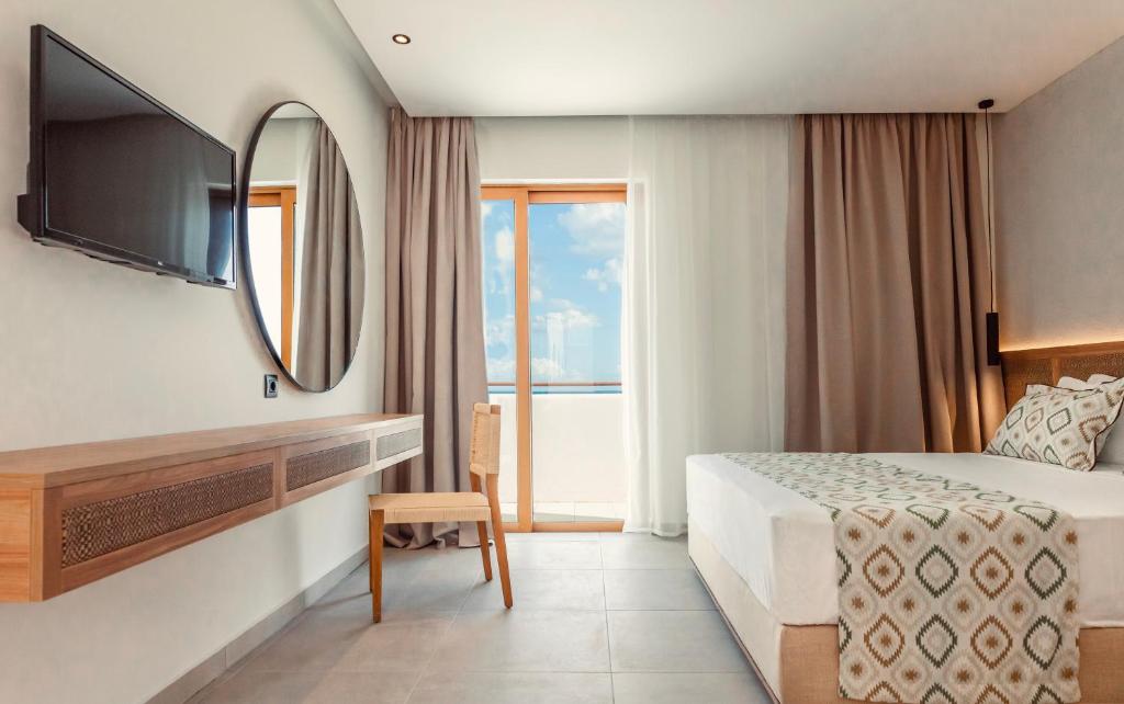 A bed or beds in a room at Blue Sea Island