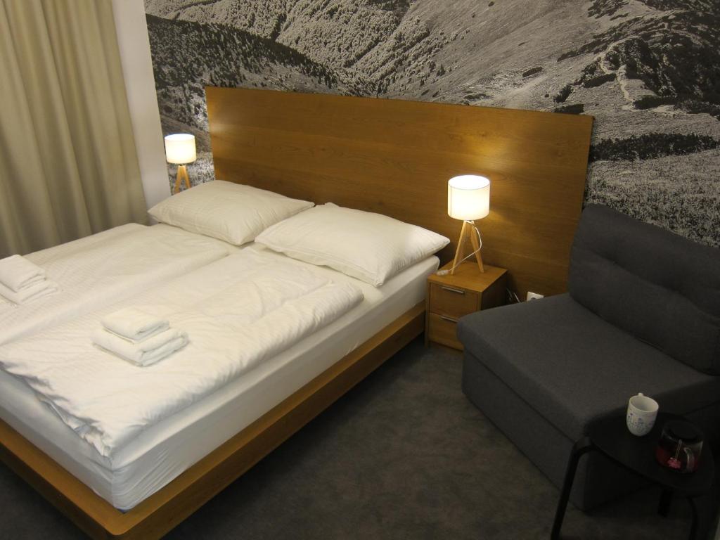 Postel nebo postele na pokoji v ubytování Apartmány 45 Valča