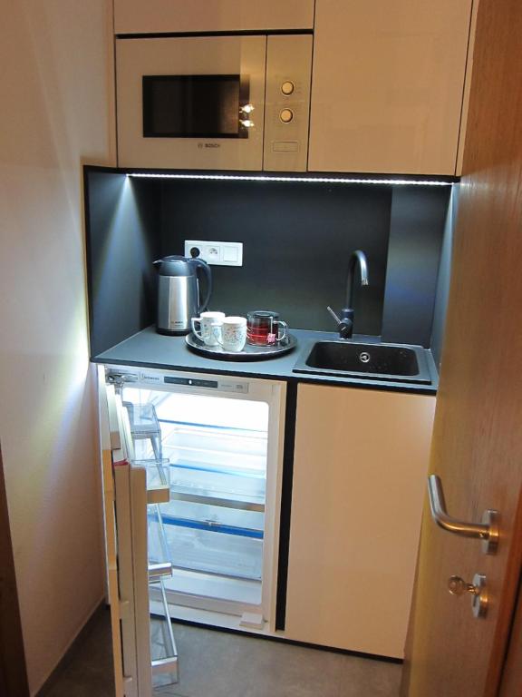 Kuchyň nebo kuchyňský kout v ubytování Apartmány 45 Valča