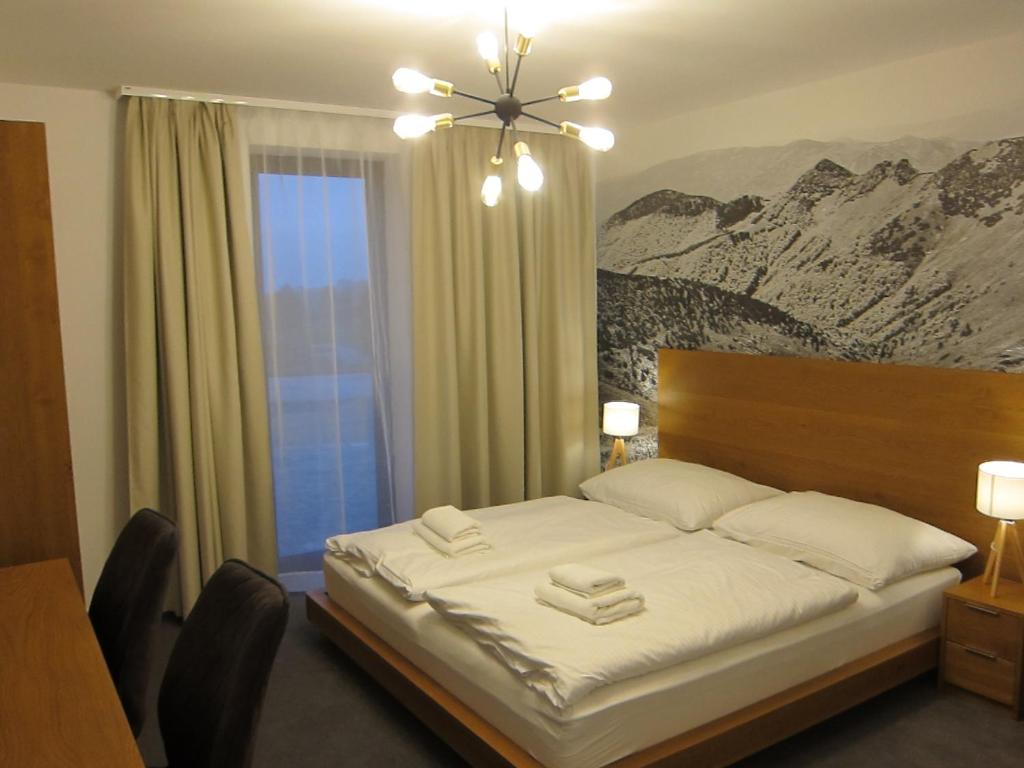 Postel nebo postele na pokoji v ubytování Apartmány 45 Valča