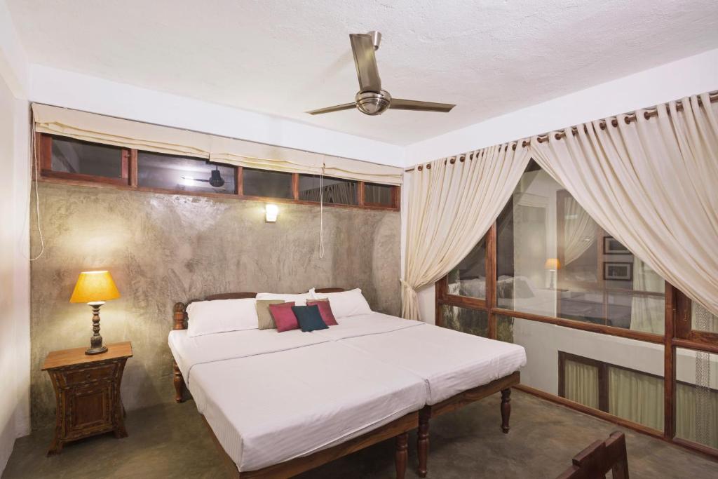 Postel nebo postele na pokoji v ubytování Niyati - Boutique Stay