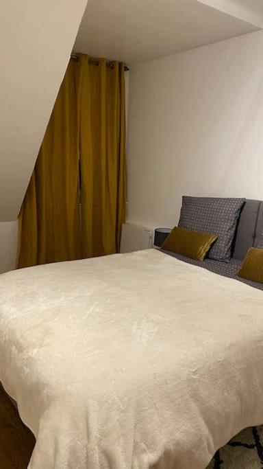 Postel nebo postele na pokoji v ubytování Charmant appartement dans l’Orne !