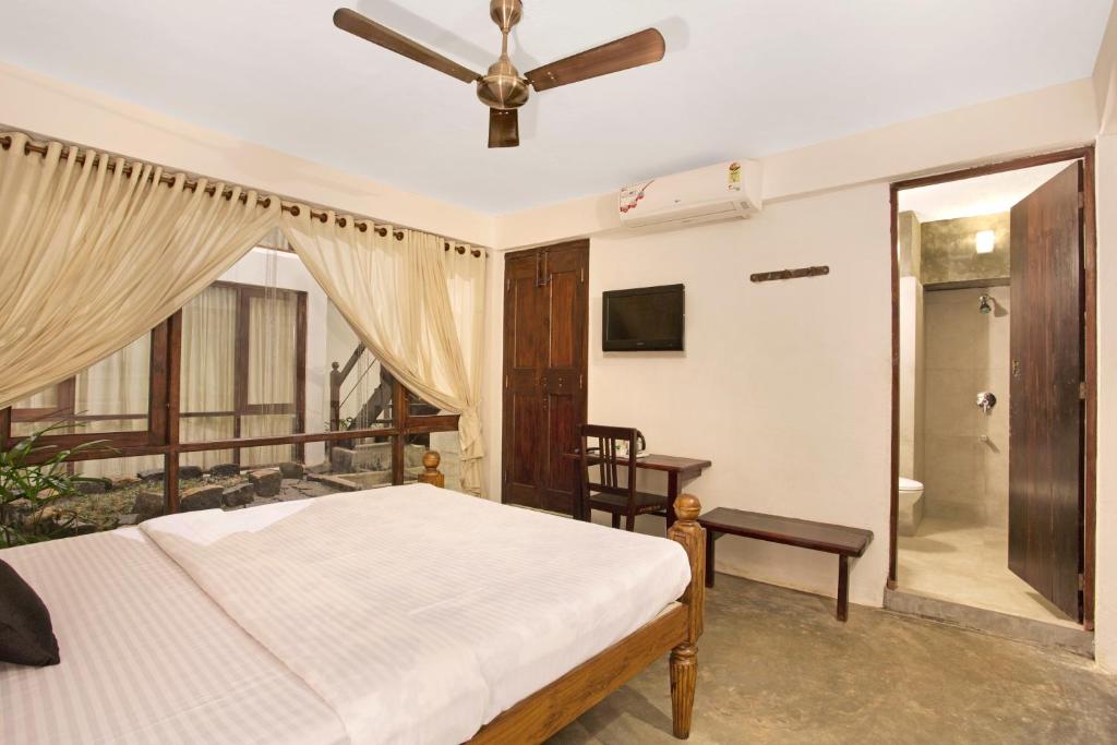 Postel nebo postele na pokoji v ubytování Niyati - Boutique Stay