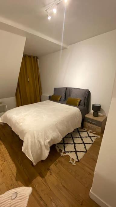 Postel nebo postele na pokoji v ubytování Charmant appartement dans l’Orne !
