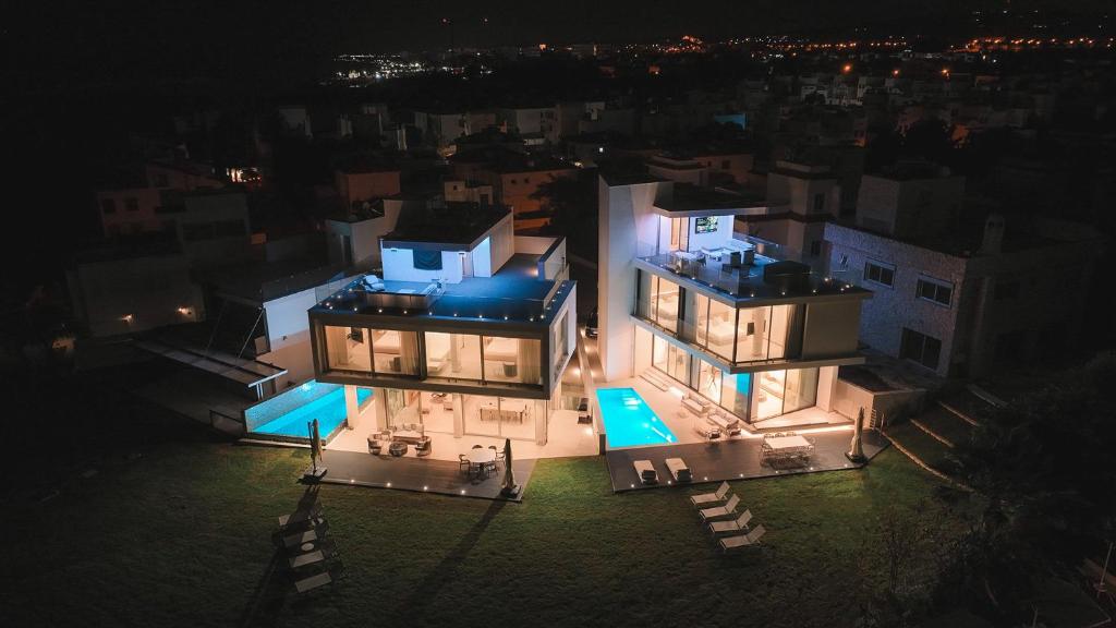 an aerial view of a large house at night at Mythical Villas Zeus and Venus in Protaras