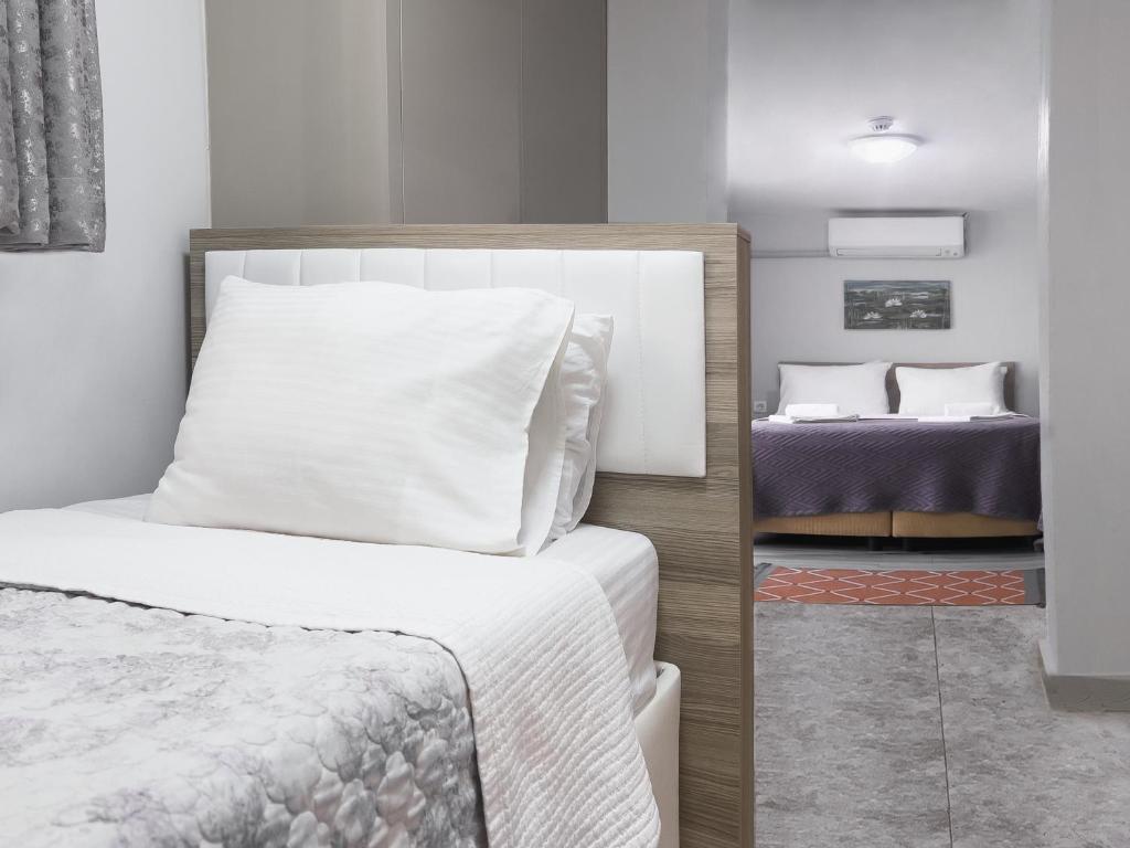 A bed or beds in a room at Azize Palas Apart Otel