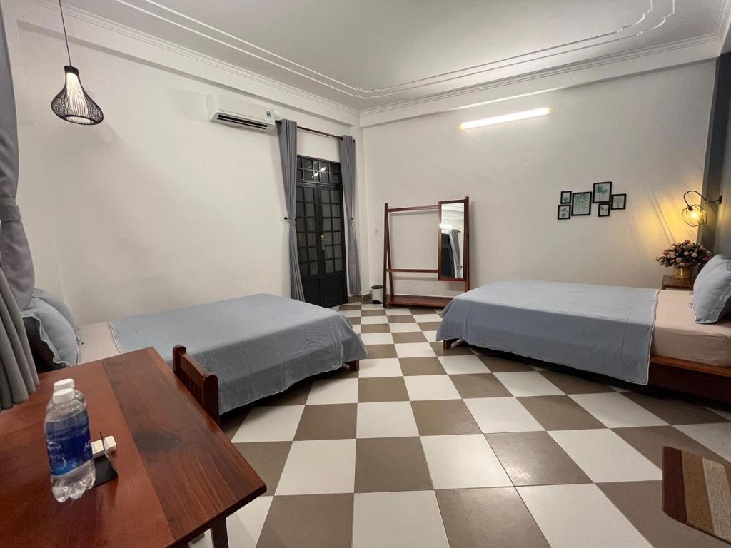 Postel nebo postele na pokoji v ubytování Queenie House