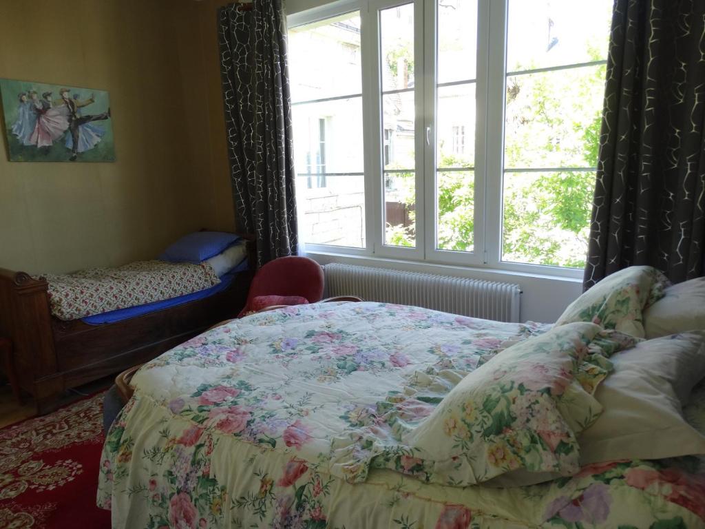 Кровать или кровати в номере Vue sur Chateau et Loire