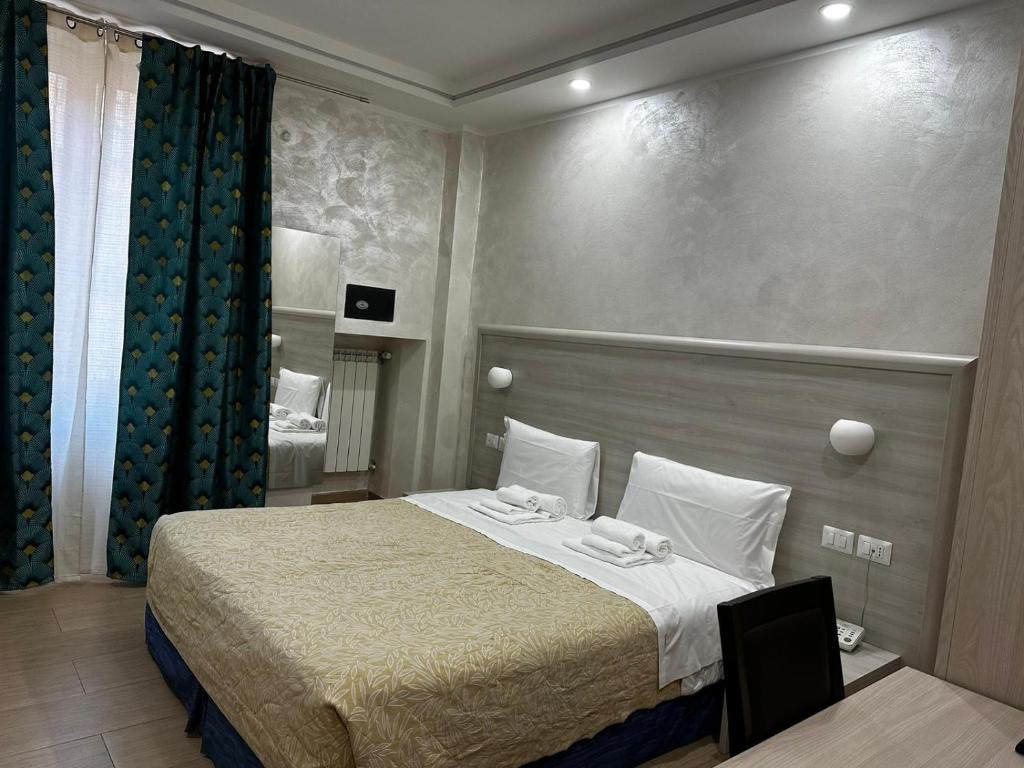 A bed or beds in a room at Hotel Orchidea