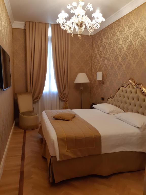 Postel nebo postele na pokoji v ubytování Ai Patrizi di Venezia