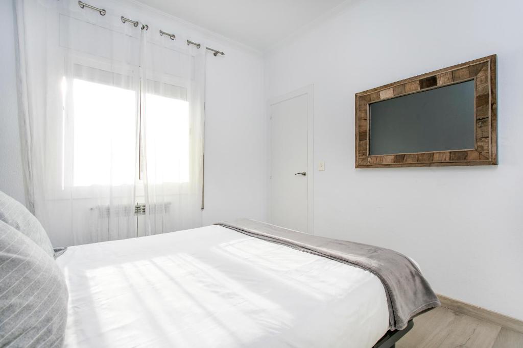 A bed or beds in a room at Click&Flat Rizal