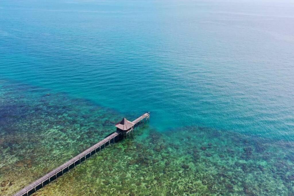 an aerial view of a dock in the water at Private Luxury Villa in private beach resort in Telukmataikan