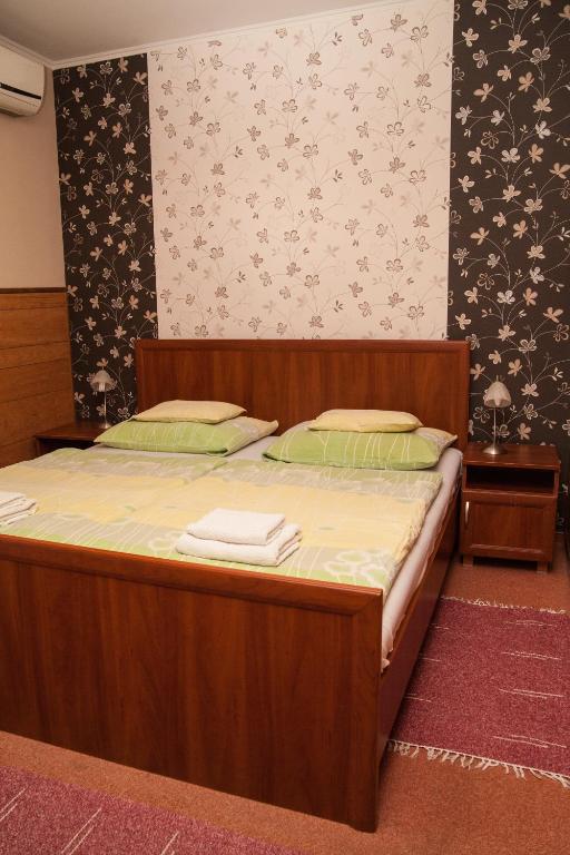 Postel nebo postele na pokoji v ubytování Korona Home