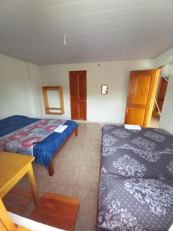 Postel nebo postele na pokoji v ubytování Hotel CHAFO
