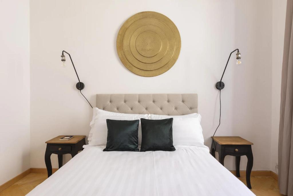 Łóżko lub łóżka w pokoju w obiekcie Daplace - Ginevra Apartment