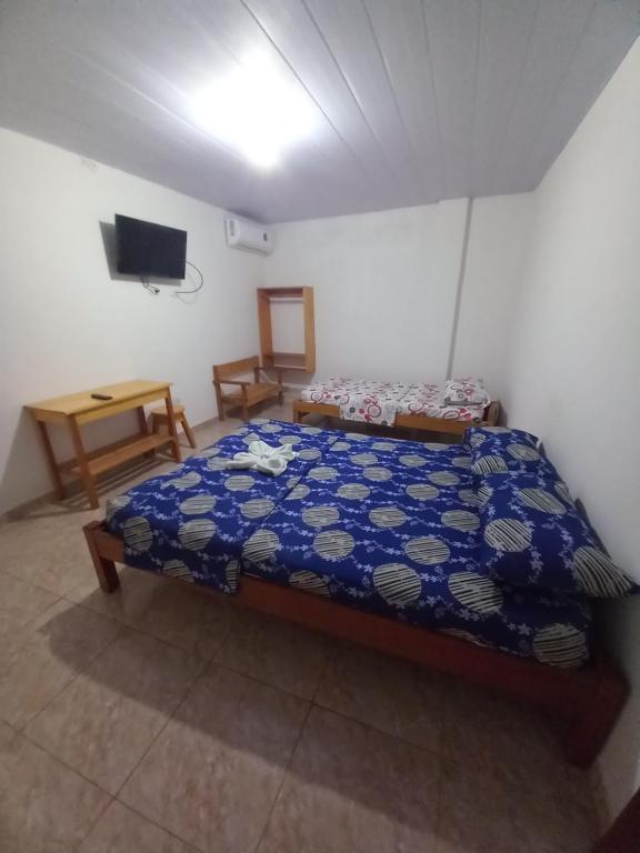 Postel nebo postele na pokoji v ubytování Hotel CHAFO