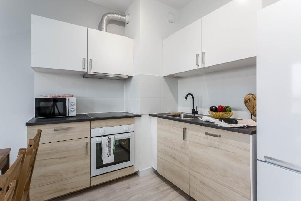 Kuchyň nebo kuchyňský kout v ubytování Chill Apartments Ursus