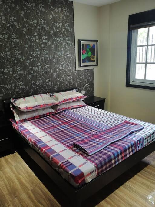 Postel nebo postele na pokoji v ubytování Avana Hills Tagaytay Villa