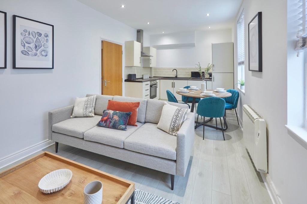 a living room with a couch and a table at Host & Stay - North Quay Apartments in Seaham