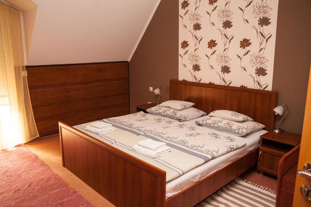 Postel nebo postele na pokoji v ubytování Korona Home