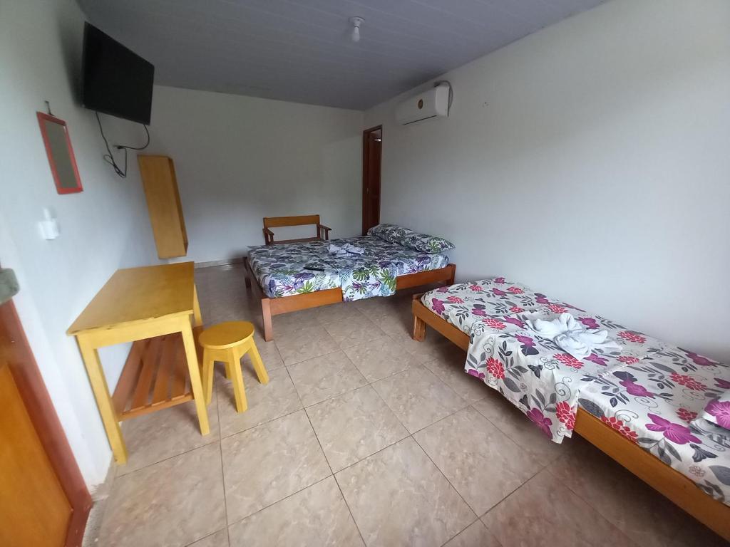 Postel nebo postele na pokoji v ubytování Hotel CHAFO