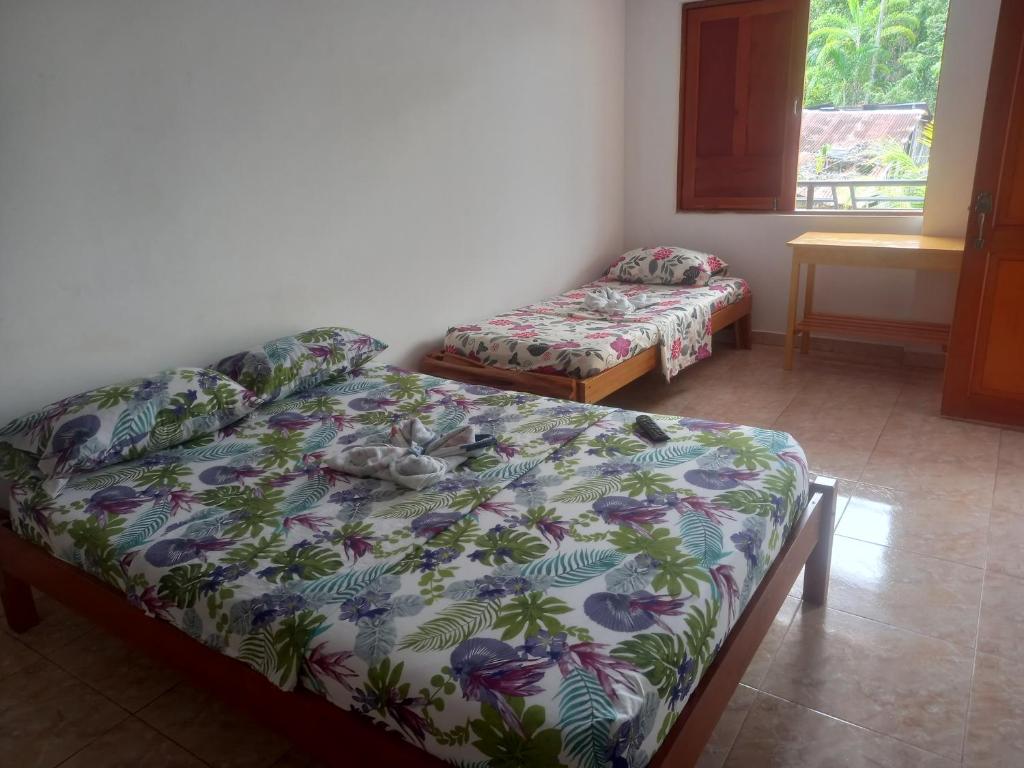 Postel nebo postele na pokoji v ubytování Hotel CHAFO