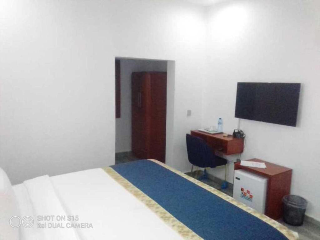 Postel nebo postele na pokoji v ubytování Credence Resorts Aco